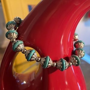 Gorgeous real turquoise and alloy metal bracelet that’s adjustable!! Classy